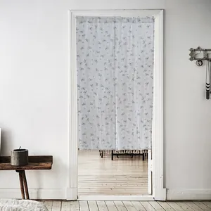 Elegant floral pattern cotton door curtain hanging in a minimalist white doorway scene