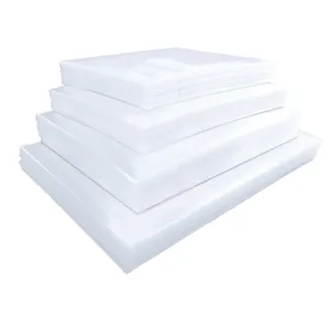 Multiple stacks of transparent food vacuum sealer bags in various sizes for storage