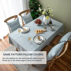 Macro view of light blue dustproof tablecloth with 3D stitching and matching pillow covers.