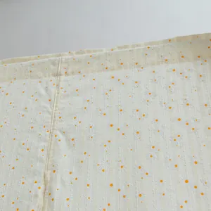 Detail view of Japanese style door curtain with white daisy print and striped fabric texture