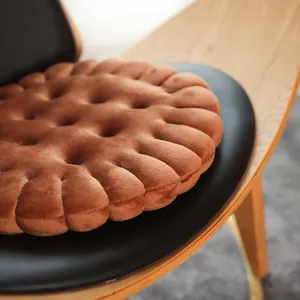 Brown plush cookie shaped round seat cushion with soft tufted detail for office chairs