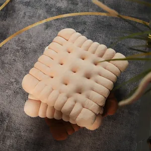 Luxury soft plush biscuit shaped chair cushion detail shown on a grey decorative rug