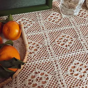Close-up of retro hollow crochet lace table runner with intricate floral patterns