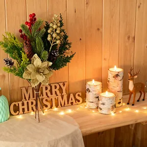 Handcrafted artificial Christmas floral bouquet with berries in cozy warm scene