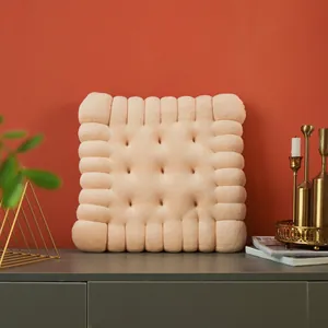 Plush cream biscuit shaped chair cushion displayed in a modern home interior setting