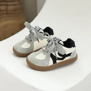 Stylish cream and grey children's GAT style sneakers with comfortable soft brown gum soles