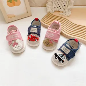 Detailed view of cute cartoon towel embroidery on soft sole baby walking shoes