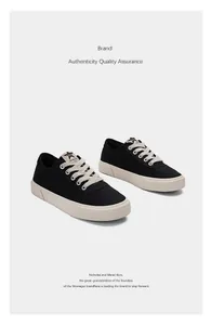 Stilvolle schwarze Canvas-Sneaker für Herren mit dicken Schnürsenkeln.