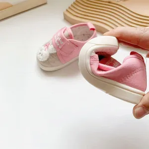 Detail showing the flexibility of the soft sole on cartoon embroidered baby walker shoes