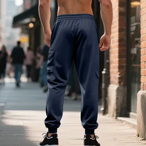 Back view of men's heavyweight navy cargo joggers with elastic waist and cuffed ankles