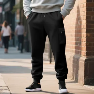 Detail view of black men's cargo joggers in heavyweight knit fabric with side pocket