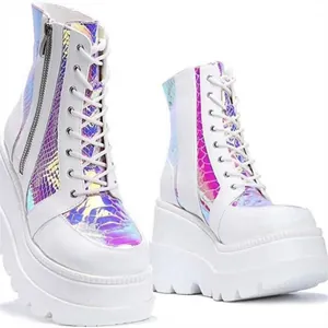 Detailed view of white platform boots featuring iridescent holographic snake pattern