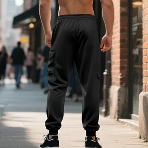 Back view of men's heavy knit black cargo sweatpants with elastic cuffs for outdoor wear