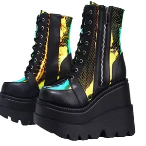 Black platform wedge boots with iridescent snake-print panels and lace-up design