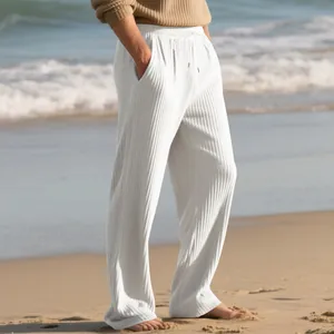 Detailed view of men's white ribbed wide-leg casual pants with drawstring waist