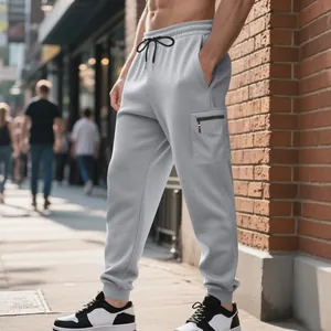Close-up detail of men's grey heavyweight knit cargo joggers with elastic drawstring waist