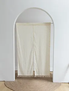 Minimalist Japanese style door curtain with orange polka dots and decorative tassels