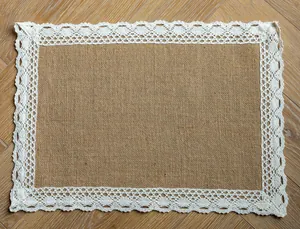 Detailed view of a rustic rectangular jute placemat with an elegant white lace border