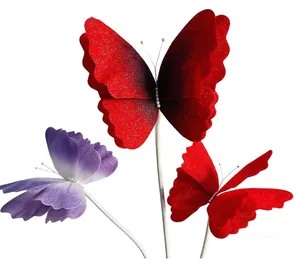 Close-up of elegant red and purple gradient mesh butterflies for wedding room decoration