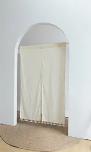 Elegant cream Japanese style doorway curtain with orange dots and tassel trim detail