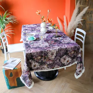 Detail shot of heavy-duty yarn-dyed purple floral tablecloth with elegant fringe