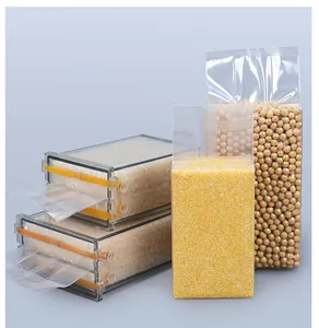Detail showing grain vacuum bags shaped by clear rectangular rice brick molds.