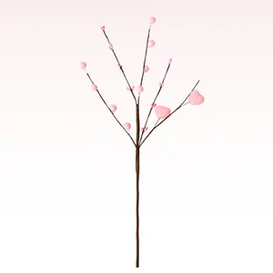 Detail of artificial heart berry branch with pink foam berries for romantic decor