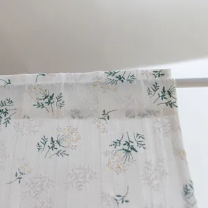 Macro view showing the vintage floral print and texture of this white cotton short curtain