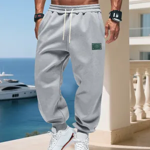 Fleece-lined grey joggers for men with elastic waistband and drawstring detail