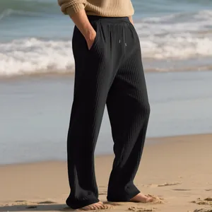 High-quality detail of black ribbed fabric on men's casual wide-leg drawstring pants