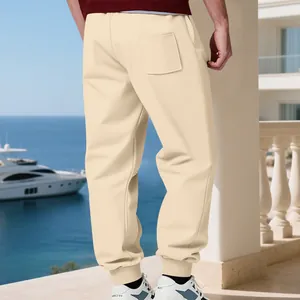 Back view of men's beige fleece joggers with cuffed ankles for casual winter wear