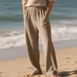 Close-up view of men's casual textured ribbed wide-leg trousers with drawstring waist.