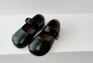 Detailed view of black Mary Jane leather shoes for girls with soft soles.