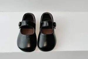 Detailed top view of classic black leather girls Mary Jane shoes with soft comfortable soles