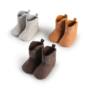 Bottes de cowboy pour bébé à semelle souple proposées en gris, beige et marron foncé