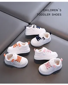Collection of white toddler walking shoes for boys and girls in multiple colors