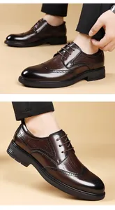 Detail of brown leather Brogue shoes with intricate carvings and crocodile pattern