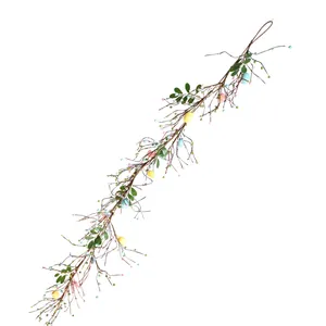 Detailed view of colorful Easter egg and berry vine garland for wall hanging decoration