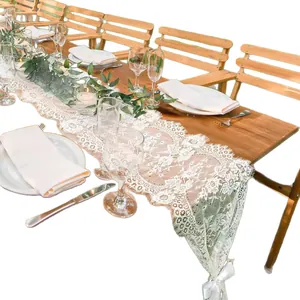 Elegant white floral lace table runner for wedding banquet and French style dining decor.