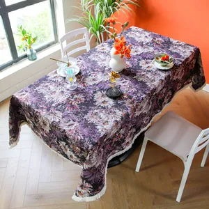 Detailed view of high-density purple floral jacquard tablecloth featuring elegant white fringes