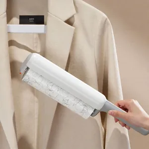 White handheld lint roller with ergonomic handle for clothes hair removal and cleaning