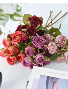 Detailed view of 8-head artificial roses with vintage burnt edges for elegant home decor