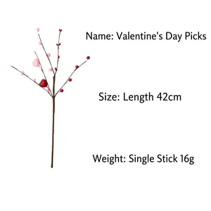 Detail of artificial berry branch with red and pink hearts for festive decoration