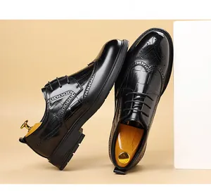 Exquisite detail of black leather Brogue shoes for men featuring classic carved patterns