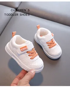 Toddler walking shoes in white waterproof microfiber leather with orange accents
