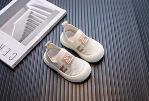 Close-up of off-white breathable mesh toddler sneakers with soft flexible soles