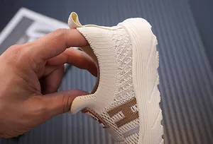 Close-up of breathable flyknit sneaker showing soft heel flexibility for toddlers