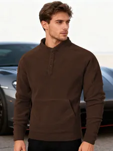 Close-up detail of men's brown slim-fit fleece henley sweatshirt with a stand collar