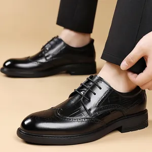 Classic black leather brogue dress shoes for men with wingtip and crocodile texture