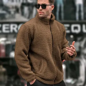 Close-up of men's brown teddy fleece jacket with stand collar and zipper detail.